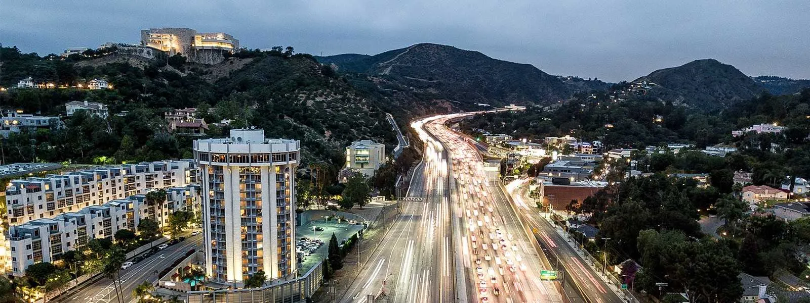 Aerial view of Hotel Angeleno and the 405 Freeway at night
