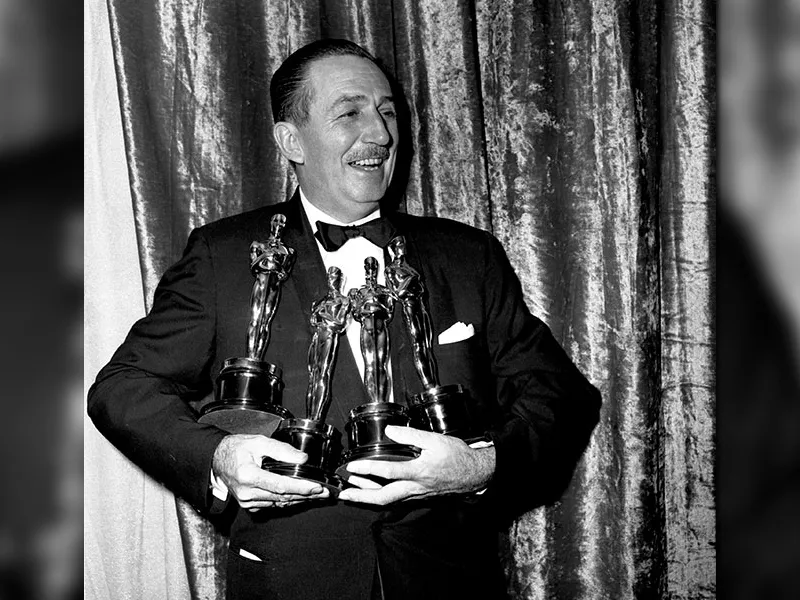 Walt Disney with his four Oscars at the 26th Academy Awards